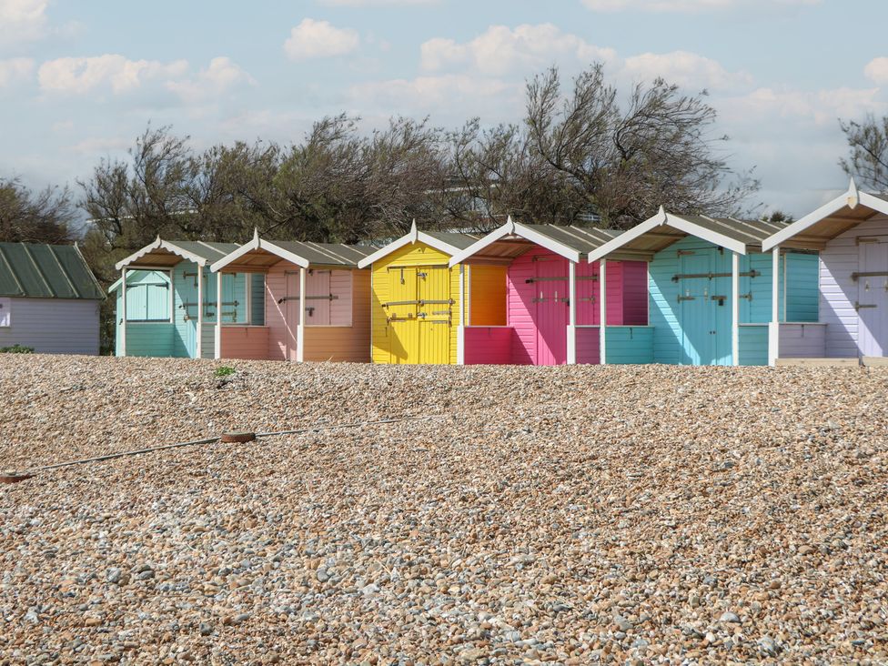 A row of beach huts at Sea Estate House in Littlehampton