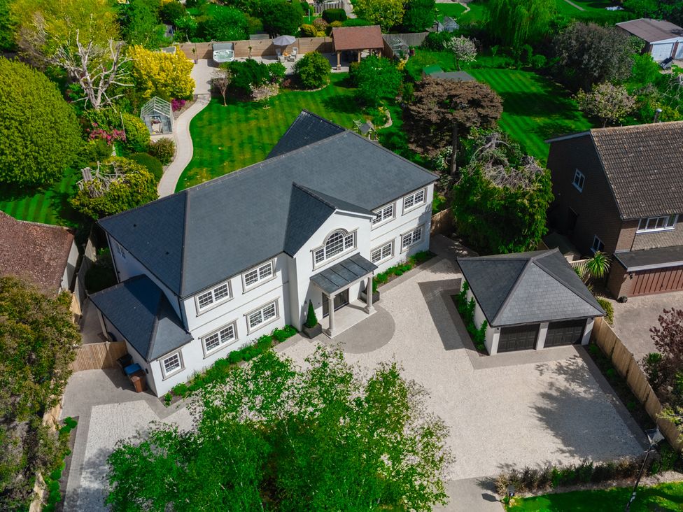 An aerial view of a house with a garage and garden at Sea Estate House in Rustington