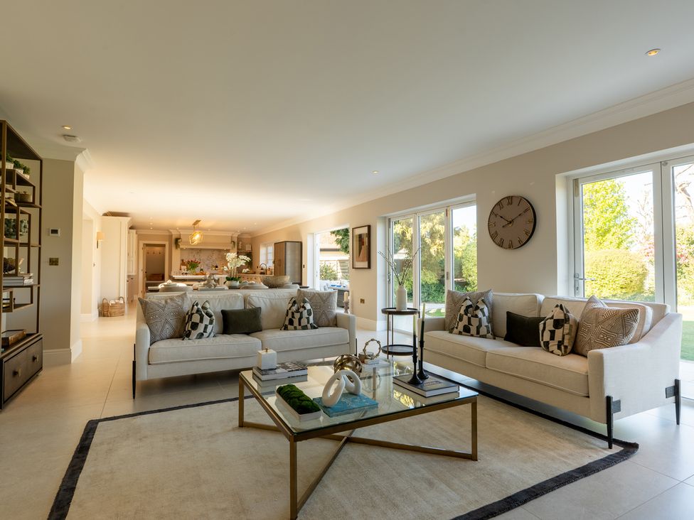 A living room with sofas and a coffee table at Sea Estate House in Rustington