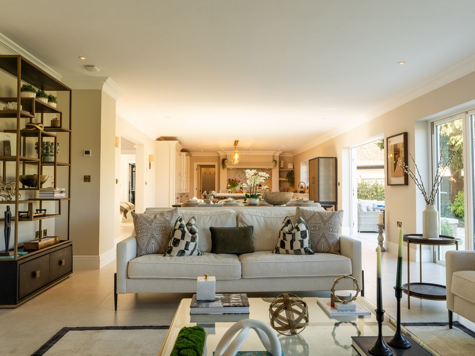 A living room with a sofa and coffee table at Sea Estate House in Rustington