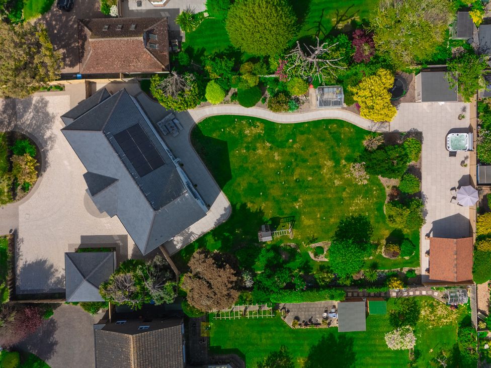 An aerial view of a garden with a house at Sea Estate House, Rustington