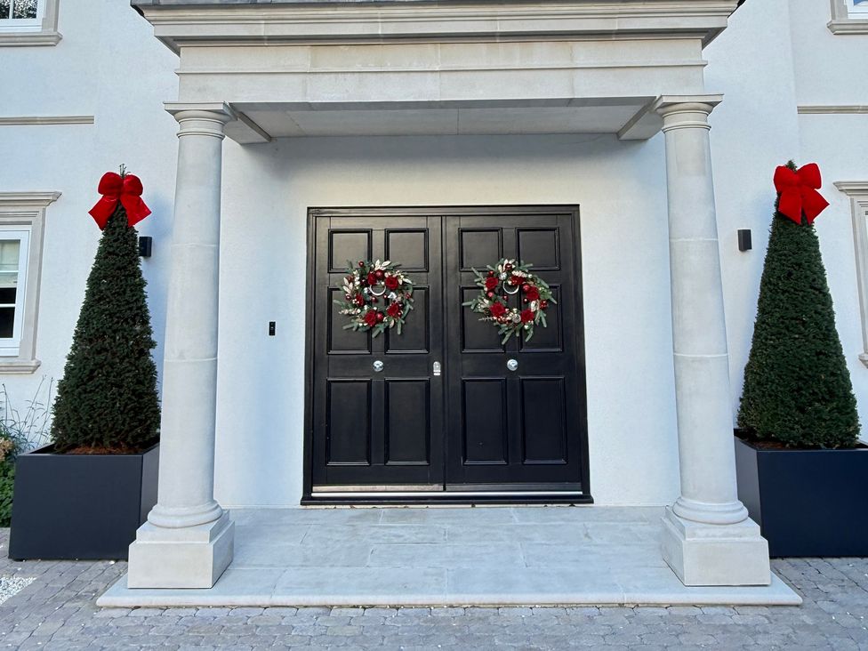 A front entrance with double doors and decorations at Sea Estate House Rustington