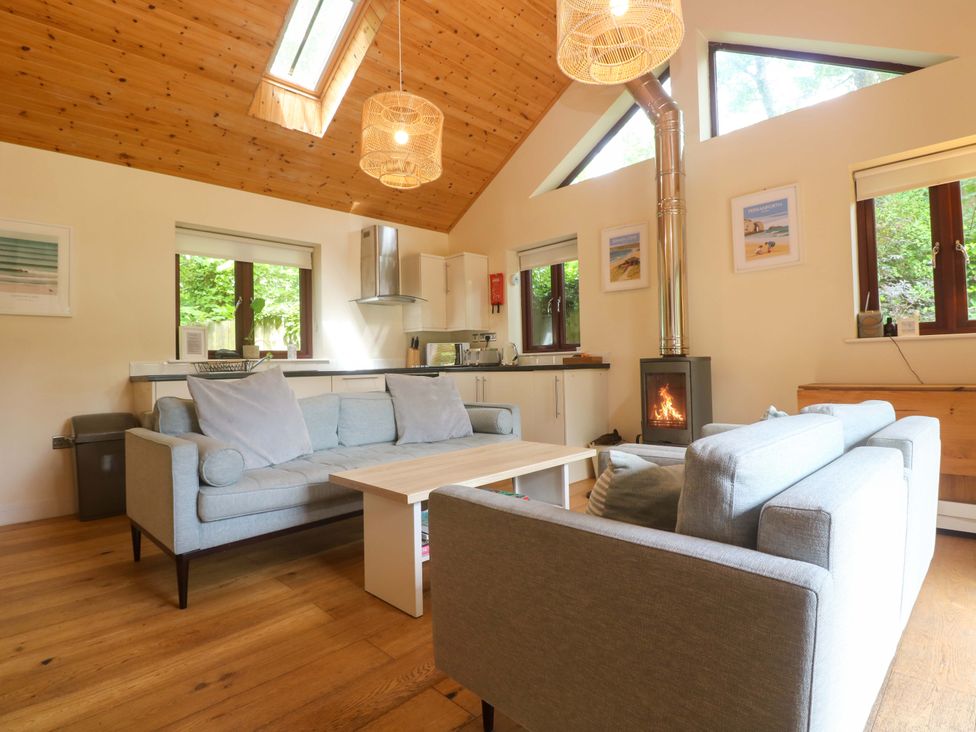A living room with a coffee table and fireplace at The Lodge at Lamburn