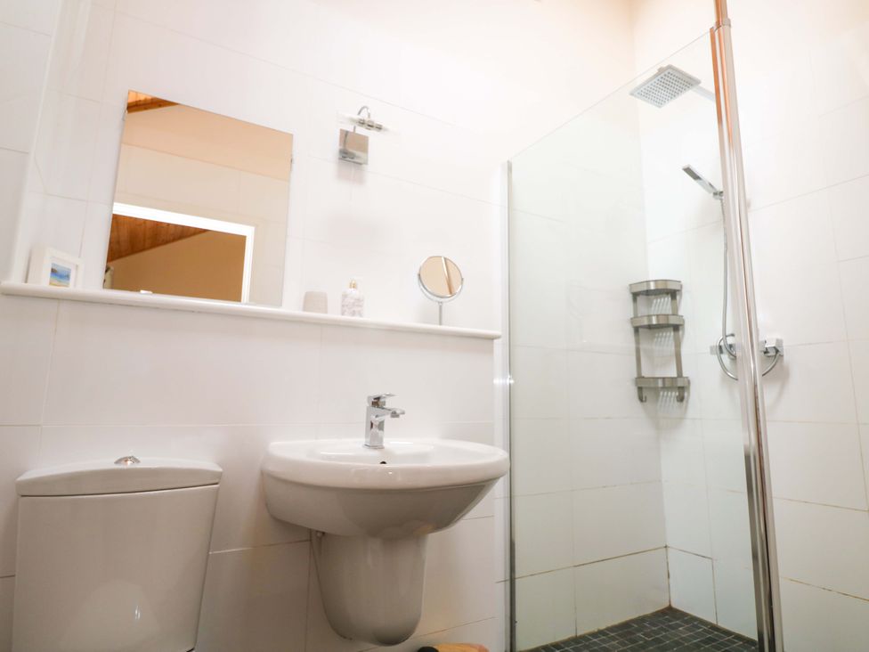 A bathroom with a sink and shower at The Lodge at Lamburn
