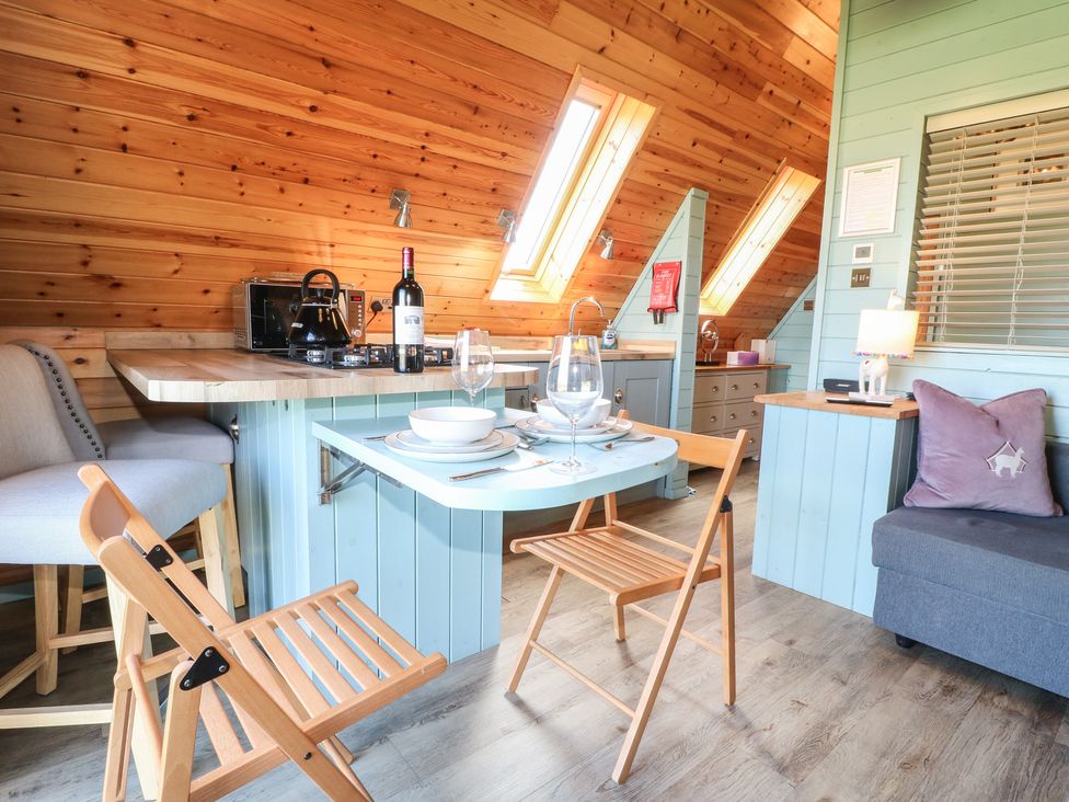 A kitchen with a countertop and seating at Skylark in Loughborough