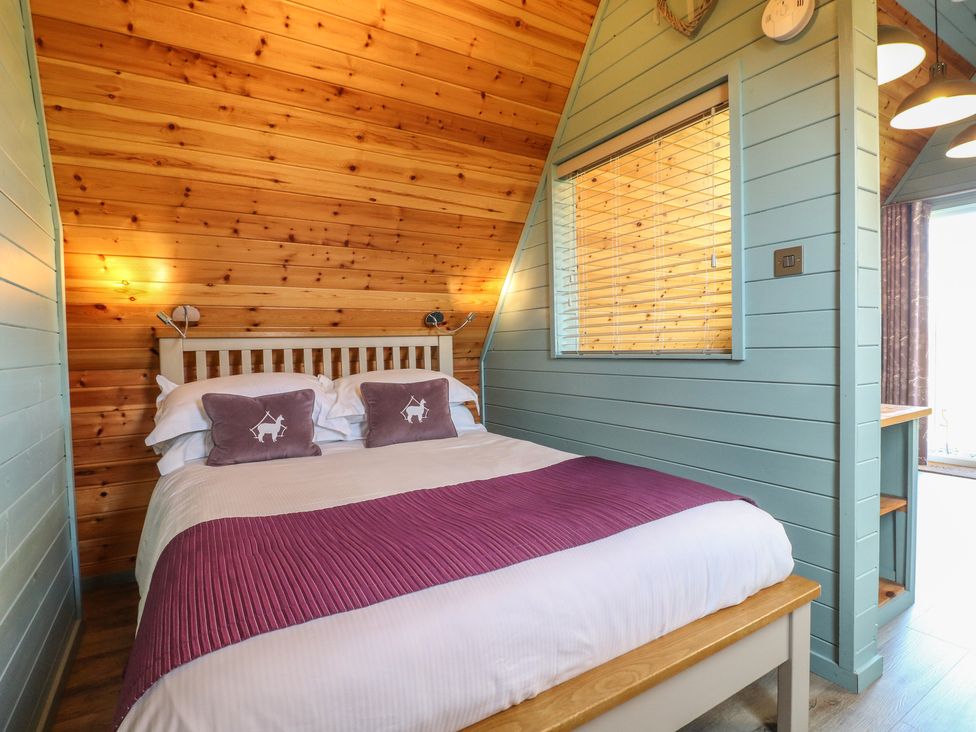 A bedroom with a bed and window at Skylark in Loughborough