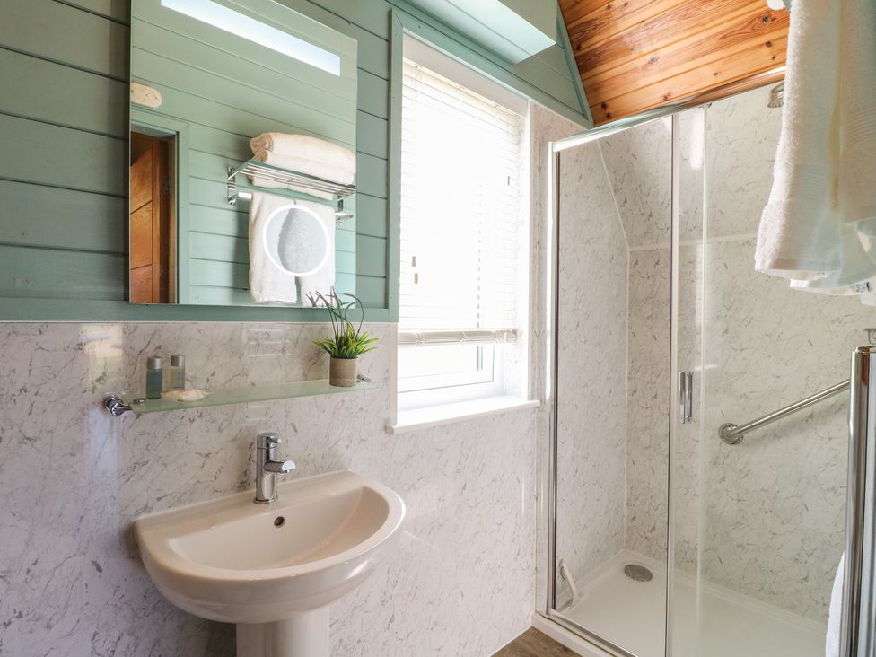 A bathroom with a sink and shower at Skylark in Loughborough