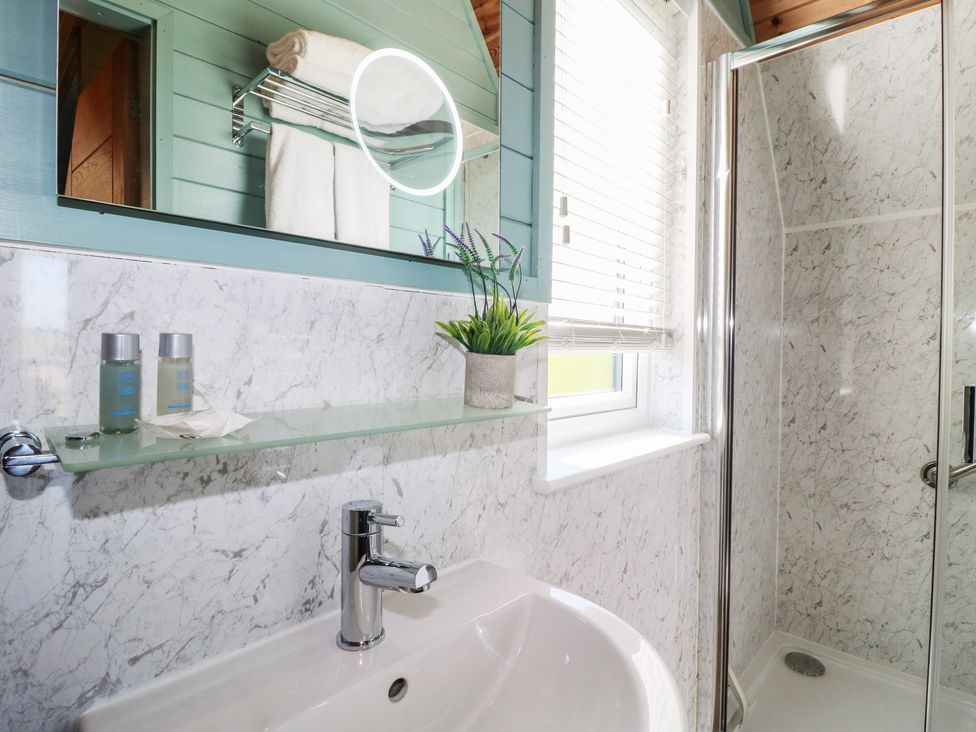 A bathroom featuring a sink and shower at Skylark in Loughborough