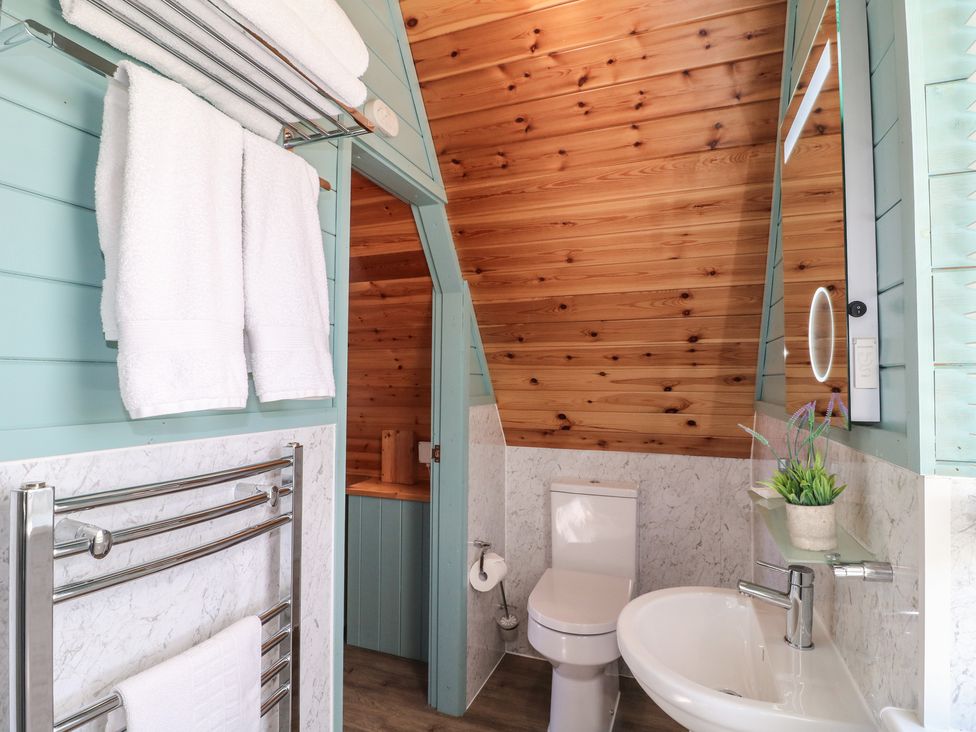 A bathroom with towels and a sink at Skylark in Loughborough