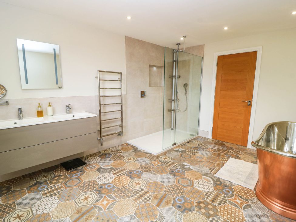 A bathroom with a shower and a sink at Hazeldene near Harvington