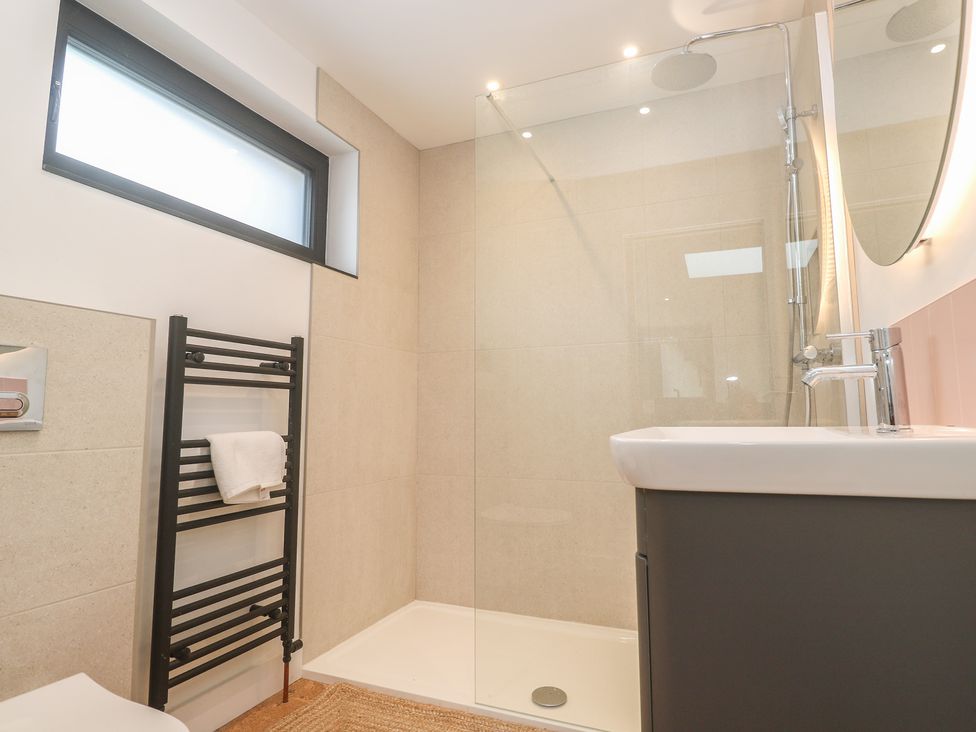A bathroom with a shower and sink at Birdsong in Gulval