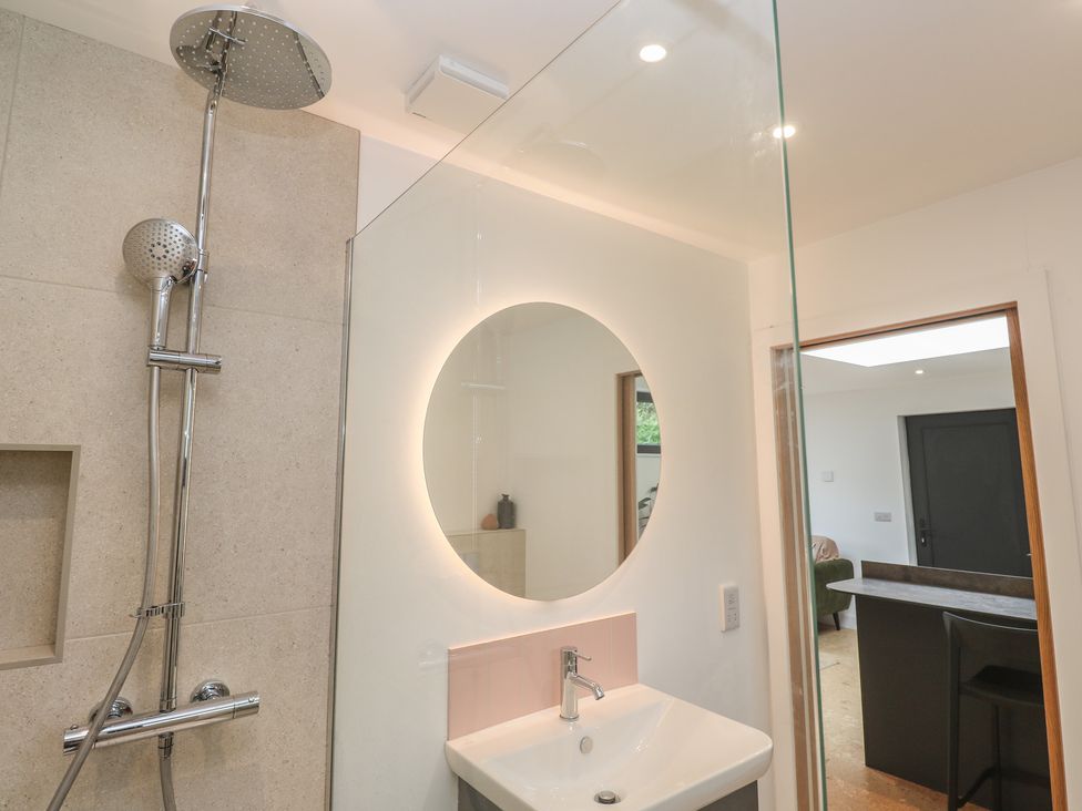 A bathroom with a shower and sink at Birdsong in Gulval
