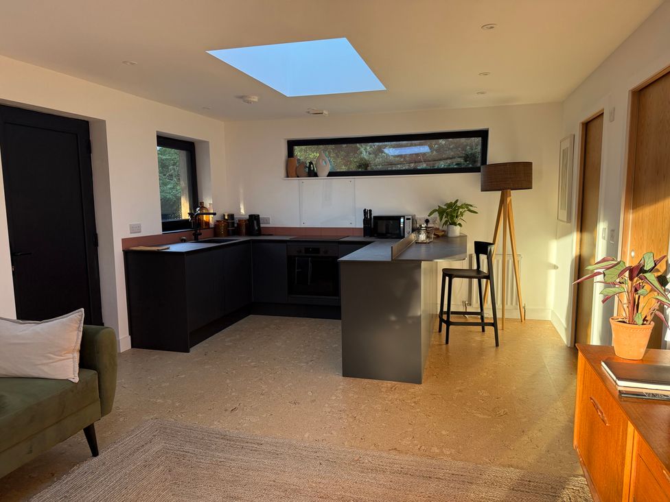 A kitchen with a skylight and countertop at Birdsong in Gulval