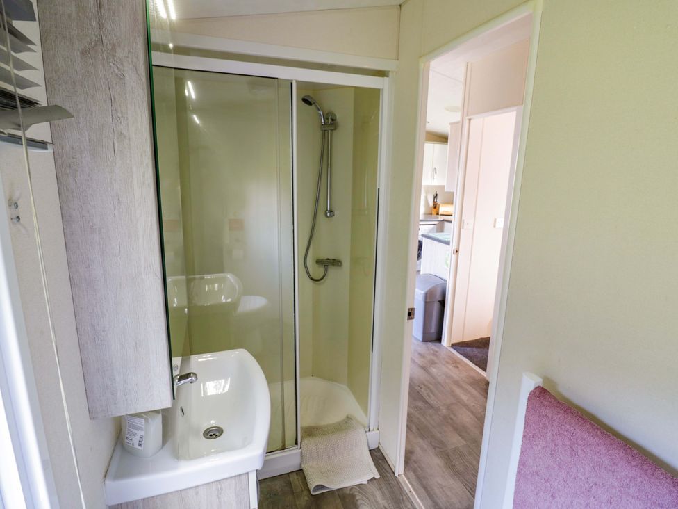 A bathroom with a shower and a sink at Laurel Lodge in Offenham