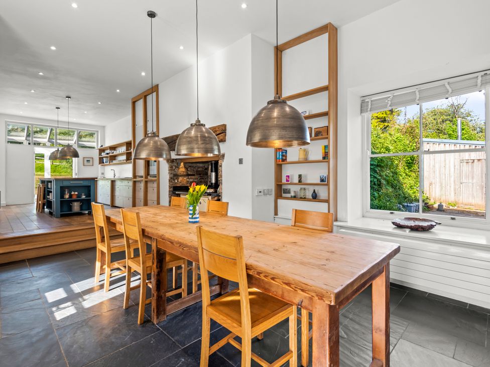 A kitchen with a dining table and chairs at Chantry Studio in Kingsbridge