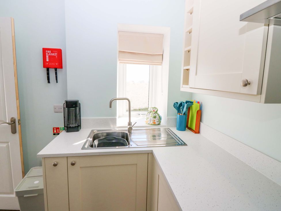 A kitchen with a sink and countertop at The Lighthouse Bothy in St Abbs