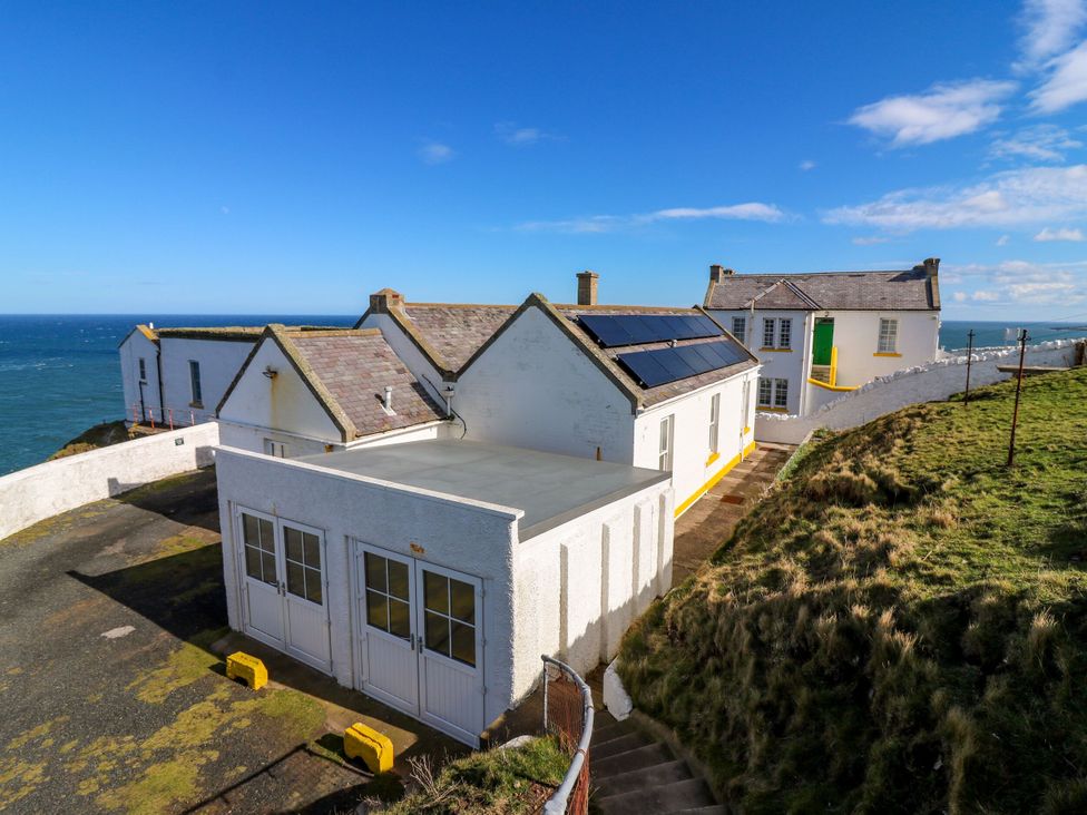 Houses with solar panels near the ocean at The Lighthouse Bothy St Abbs