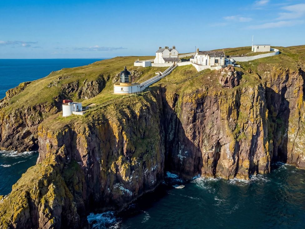 A lighthouse on a cliff by the ocean at The Lighthouse Bothy St Abbs