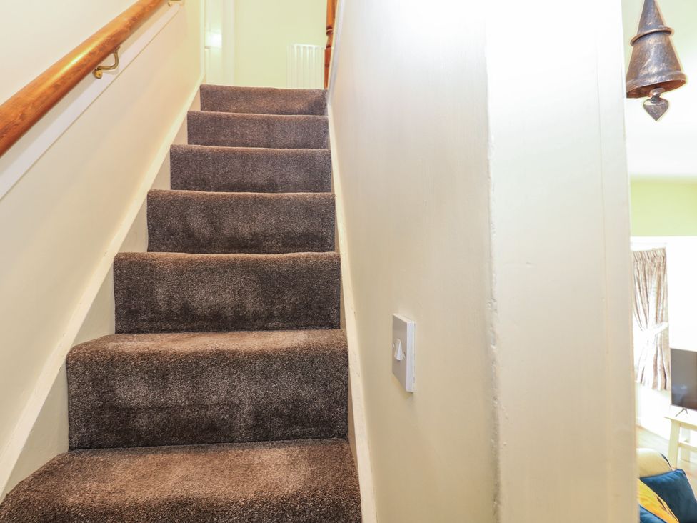 Stairs leading to the upper level at Wedgewood Cottage in Middleham