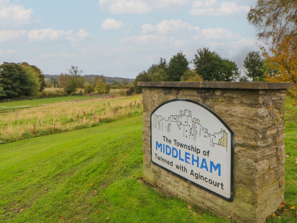A sign marking the Township of Middleham in a rural area