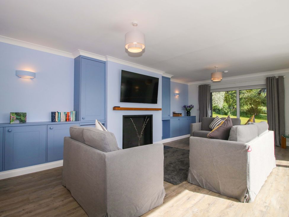 A living room with a sofa and television at Westington Hall Hatfield near Bromyard