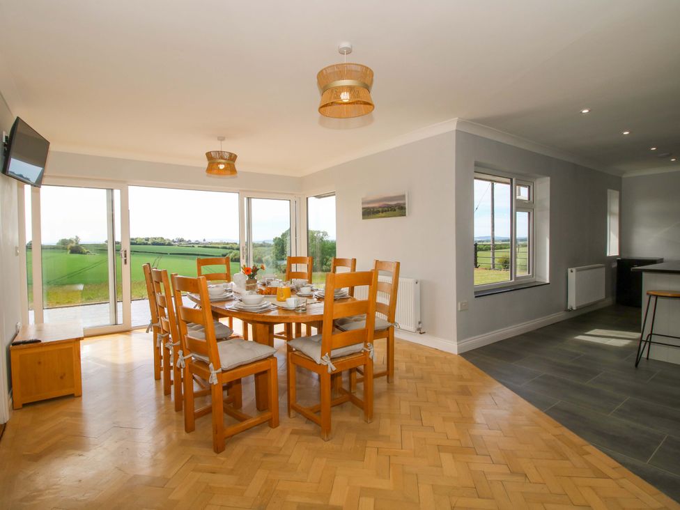 A dining room with a table and chairs at Westington Hall Hatfield near Bromyard
