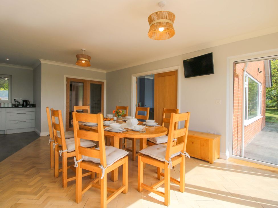 A dining room with a table and chairs at Westington Hall Hatfield near Bromyard