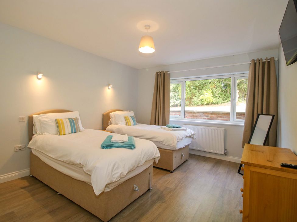 A bedroom with two beds and a window at Westington Hall Hatfield near Bromyard