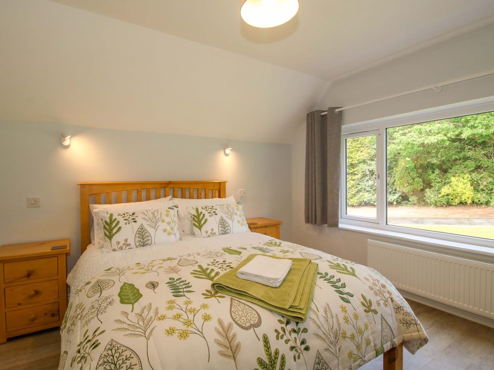 A bedroom with a bed and window at Westington Hall Hatfield near Bromyard