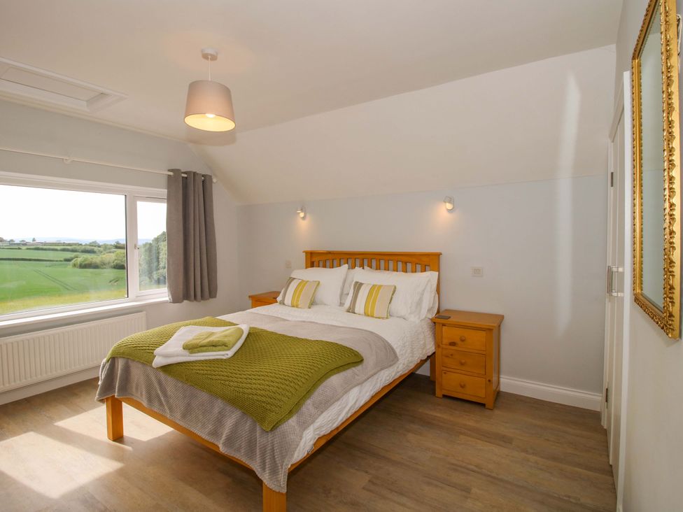 A bedroom with a bed and a window at Westington Hall Hatfield near Bromyard
