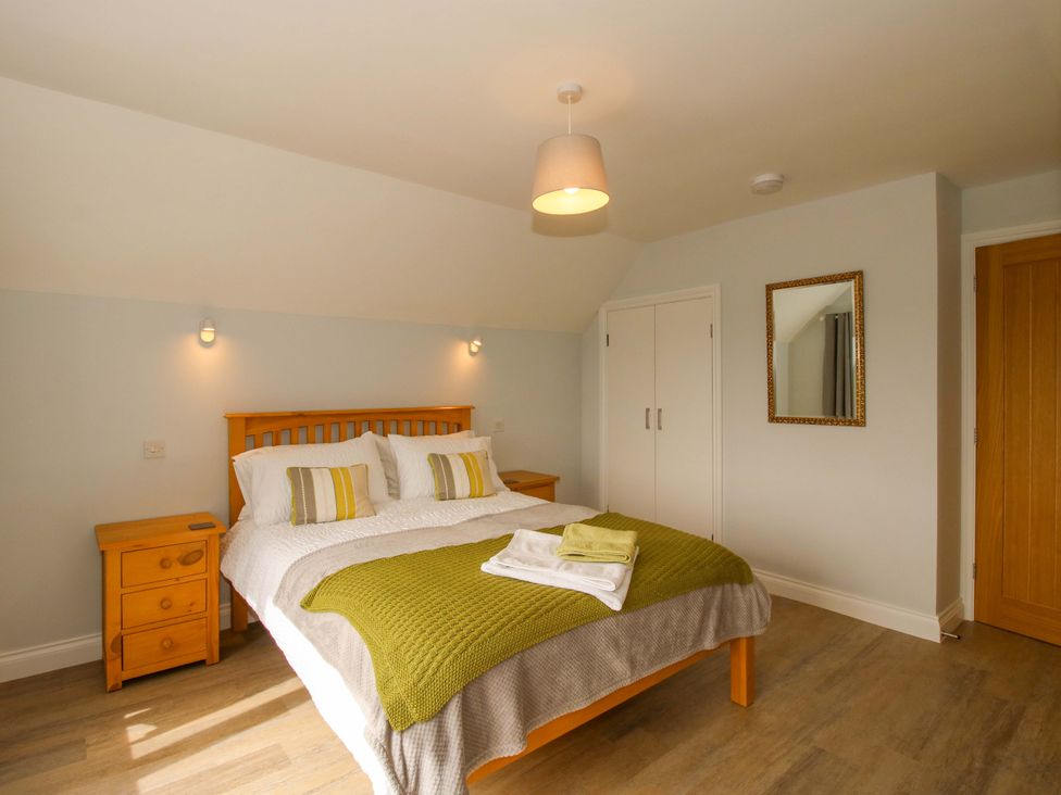 A bedroom with a bed and bedside table at Westington Hall Hatfield near Bromyard