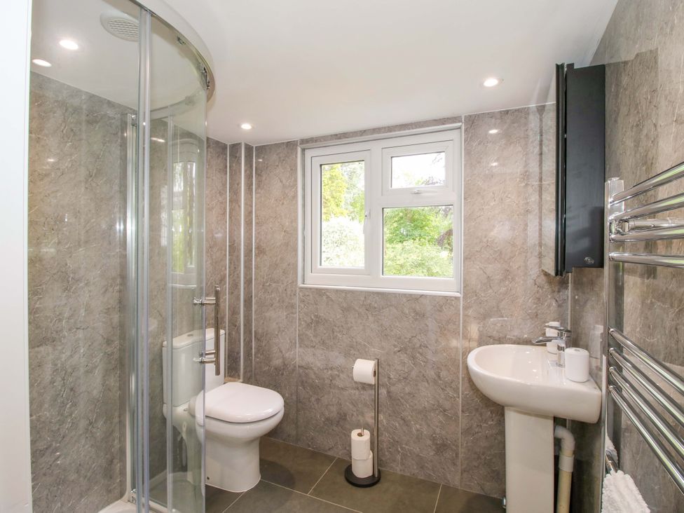A bathroom with a shower, toilet, and sink at Westington Hall in Hatfield near Bromyard