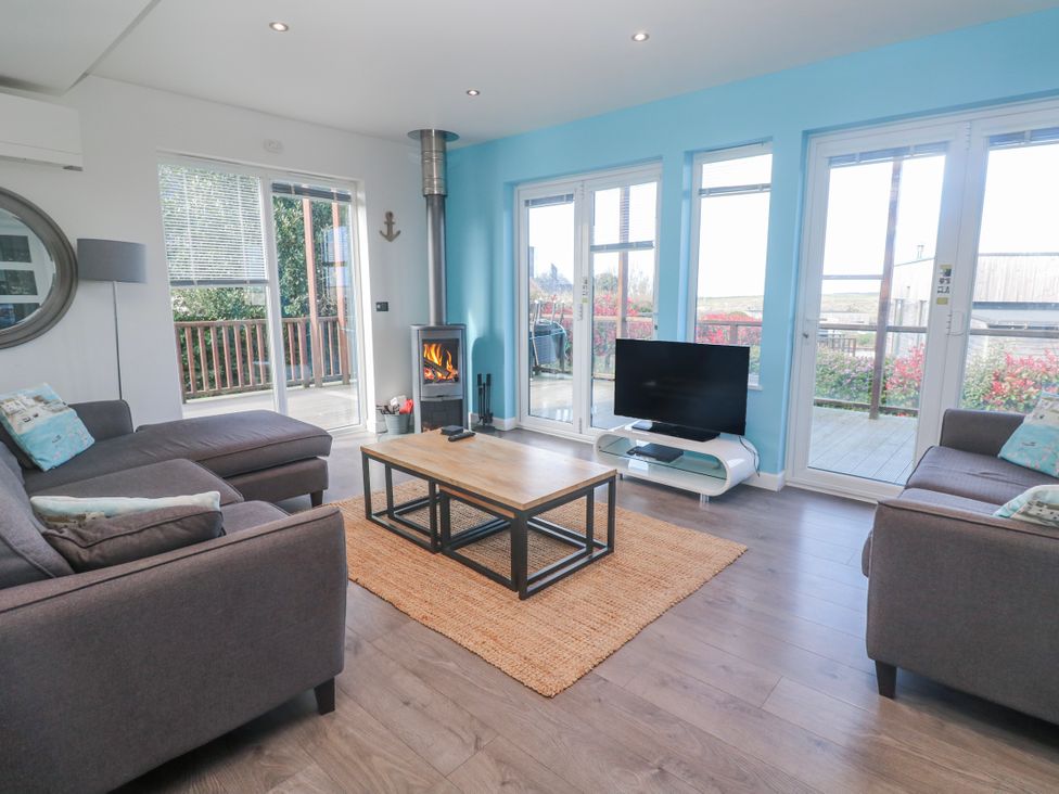 A living room with a coffee table and TV at Warleggan Redruth