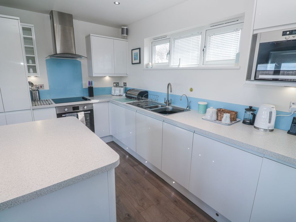 A kitchen with cabinets and appliances at Warleggan in Redruth