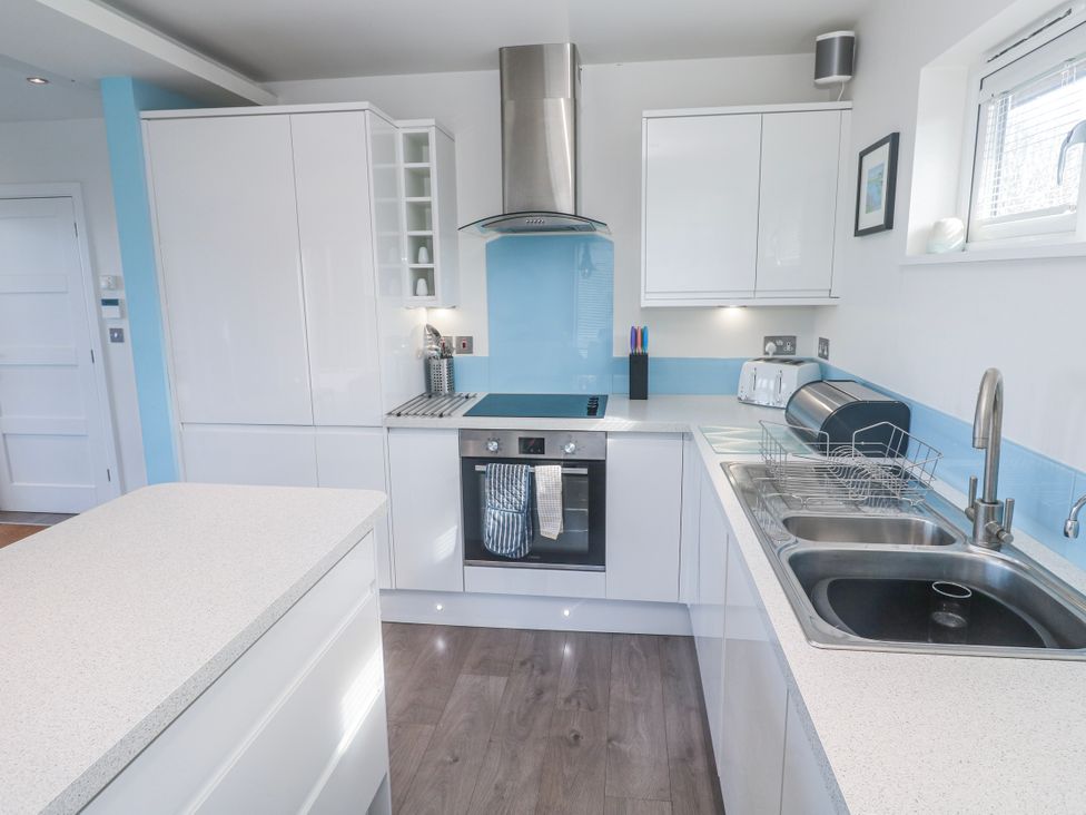 A kitchen with appliances and sink at Warleggan in Redruth