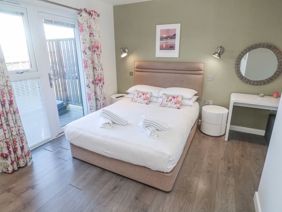 A bedroom with a bed and a desk at Warleggan in Redruth