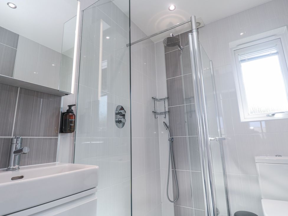 A bathroom with a shower and sink at Warleggan in Redruth