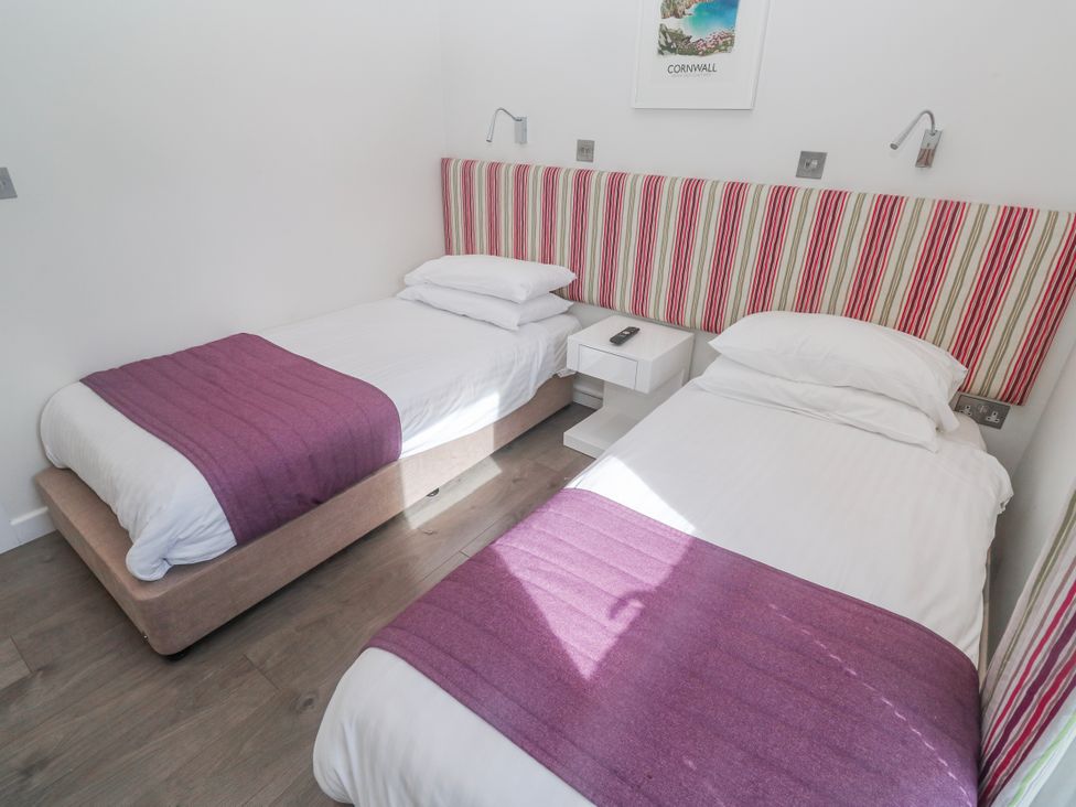 A bedroom with two single beds at Warleggan in Redruth