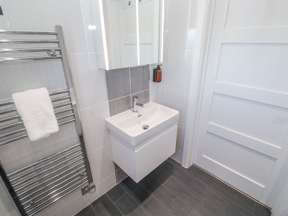 A bathroom with a sink and mirror at Warleggan in Redruth