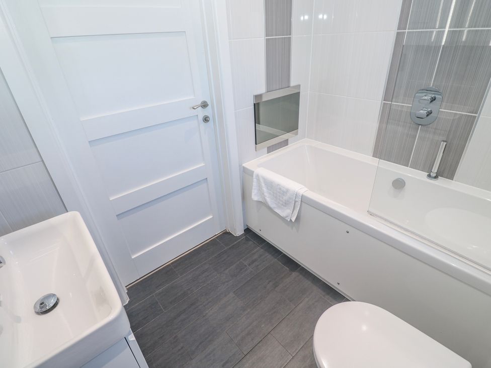 A bathroom with a sink bathtub and toilet at Warleggan Redruth