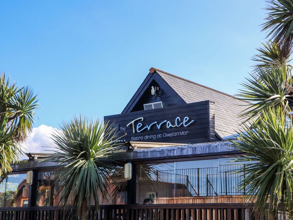 The exterior of The Terrace with palm trees at Gwelan Mor in Portreath