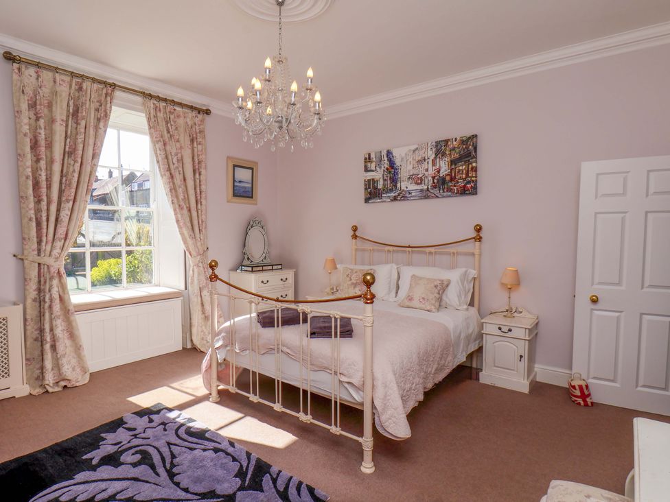 A bedroom with a bed and nightstand at Annie's Place in Sleights