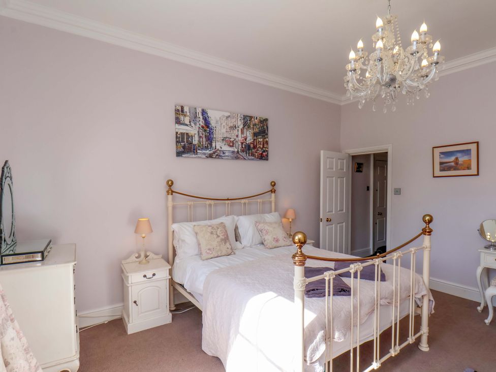 A bedroom with a bed and lamp at Annie's Place in Sleights