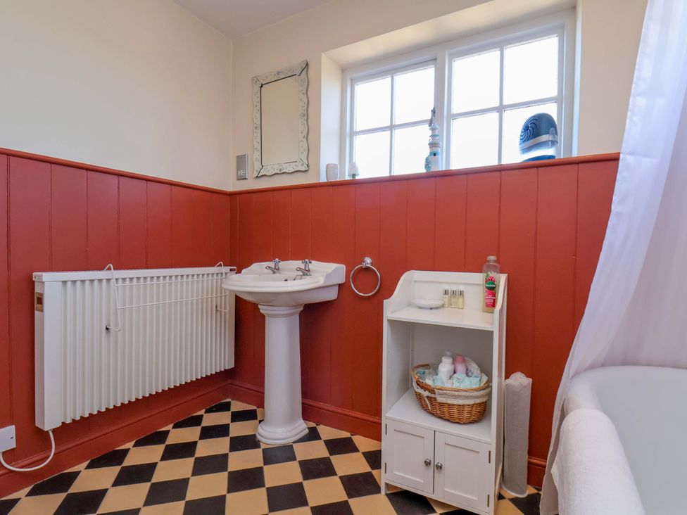 A bathroom with a washbasin and window at Annie's Place in Sleights