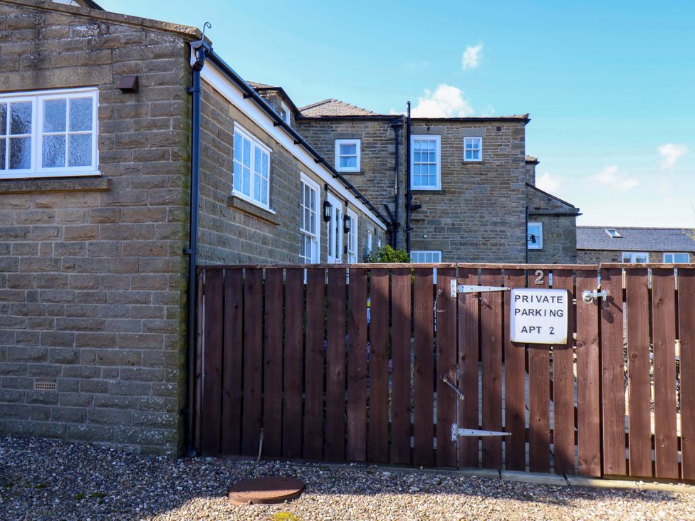 An outdoor view of a building with a parking sign at Annie's Place in Sleights