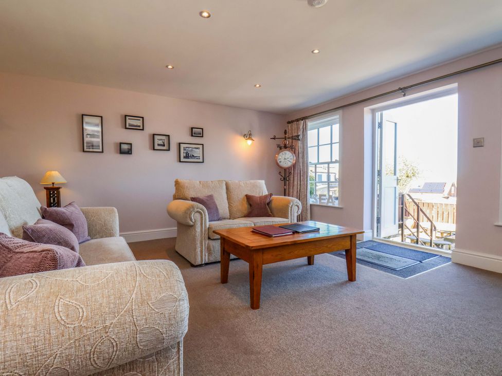 A living room with a sofa and coffee table at Annie's Place in Sleights