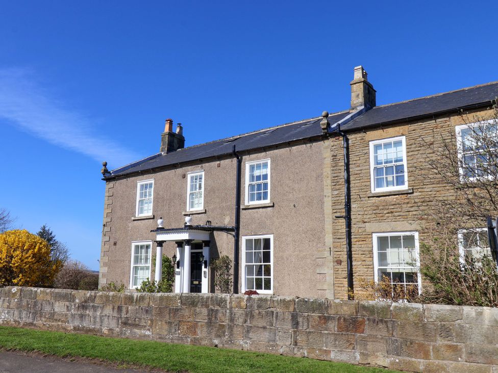 An exterior view of a house with windows and a garden at Annie's Place in Sleights
