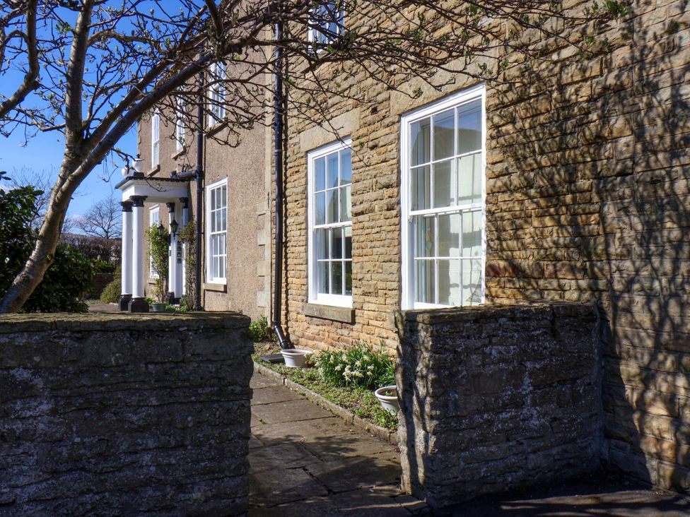 An outdoor view of a building with windows and a pathway at Annie's Place in Sleights