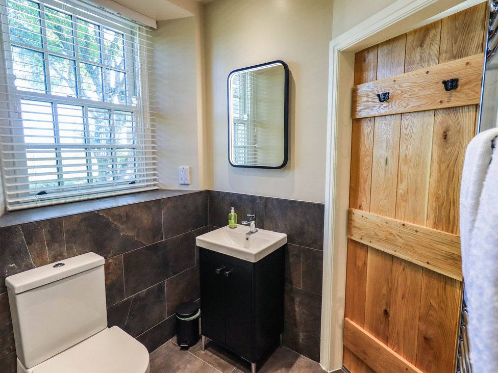 A bathroom featuring a toilet and sink at Ragged Hall Barn Settle