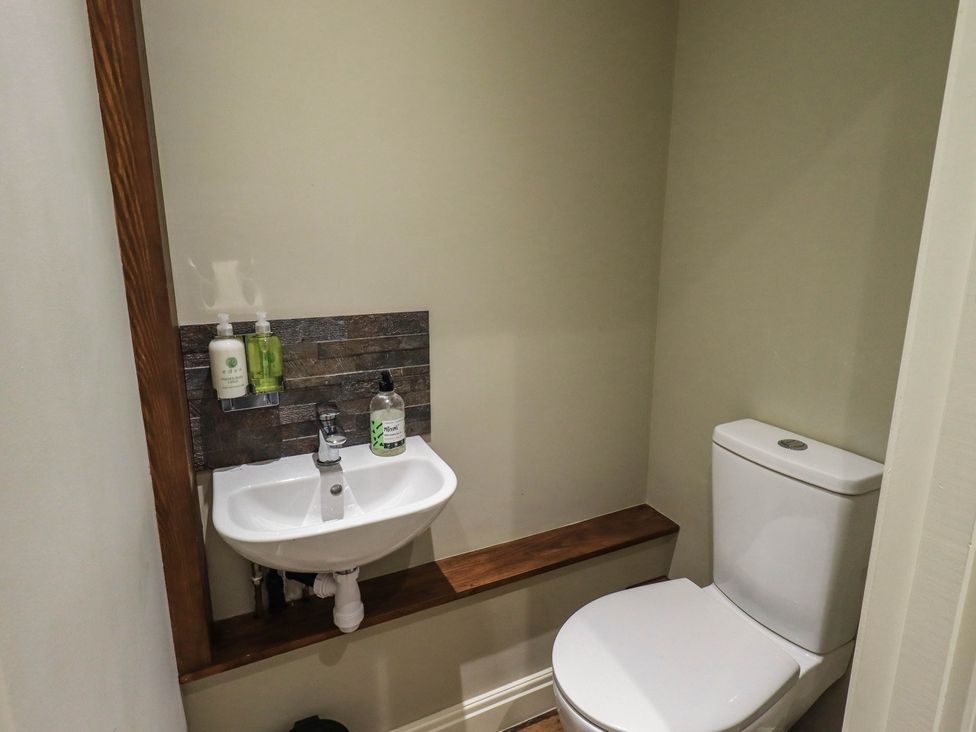 A bathroom with a sink and toilet at Ragged Hall Barn Settle